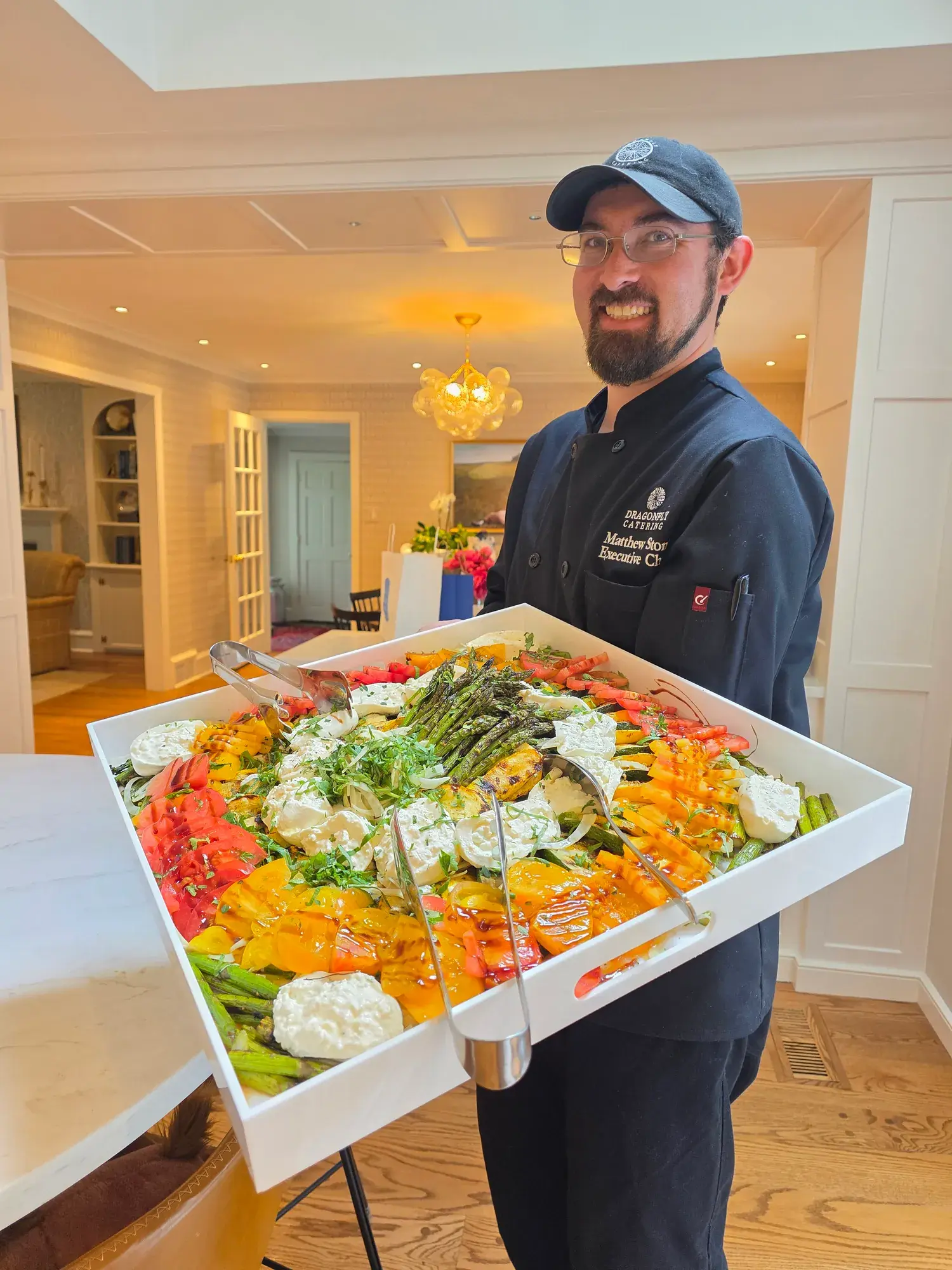 Chef Matt presenting a colorful seasonal salad platter